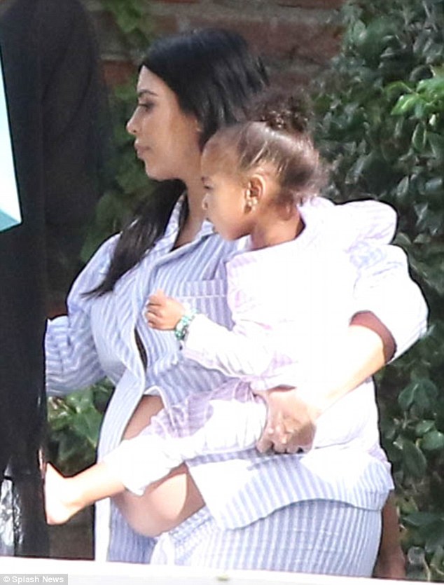 Kim Kardashian shows off her belly